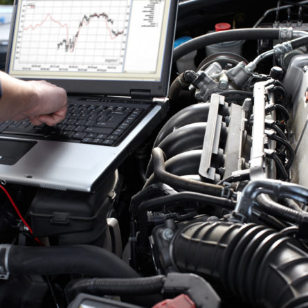 Professional car mechanic working in auto repair service.